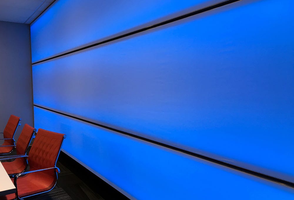 Fabric wall with rear color changing LED lighting