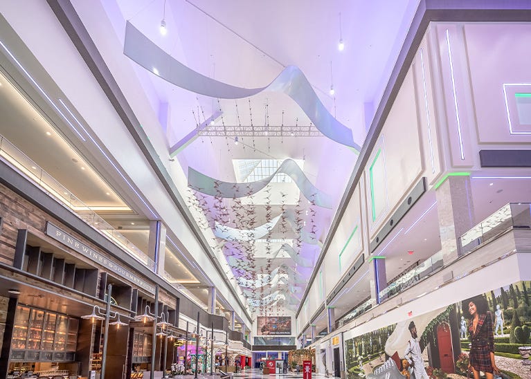 Suspended tension fabric ribbons in casino